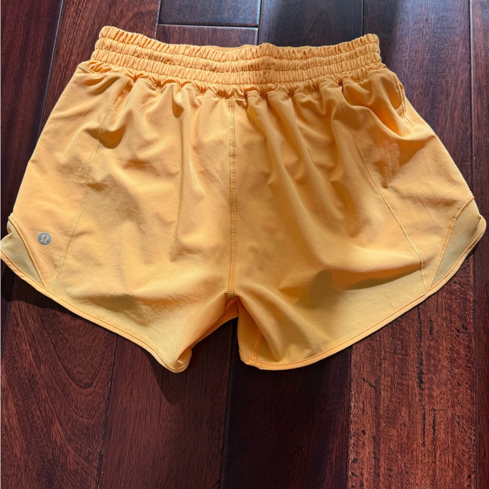 Selling Lululemon shorts size 6 in orange color - Picture 3 of 9